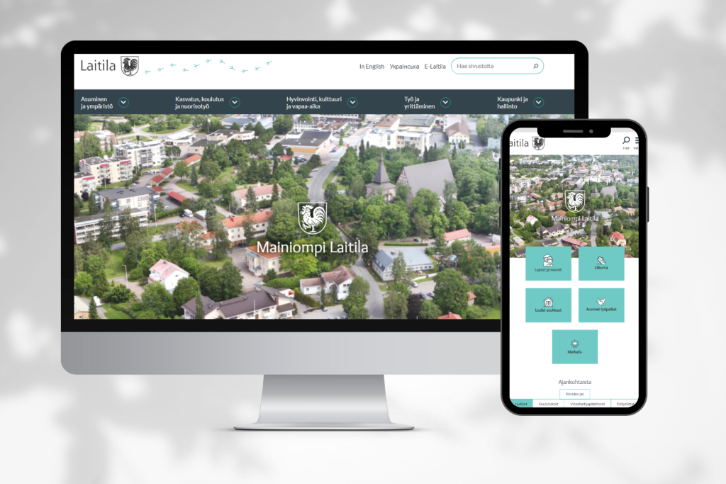 Tietokoneen ja puhelimen näytöillä Laitilan kaupungin uusi ilme, jossa on mintunvihreää sekä harmaanvihreää väriä.